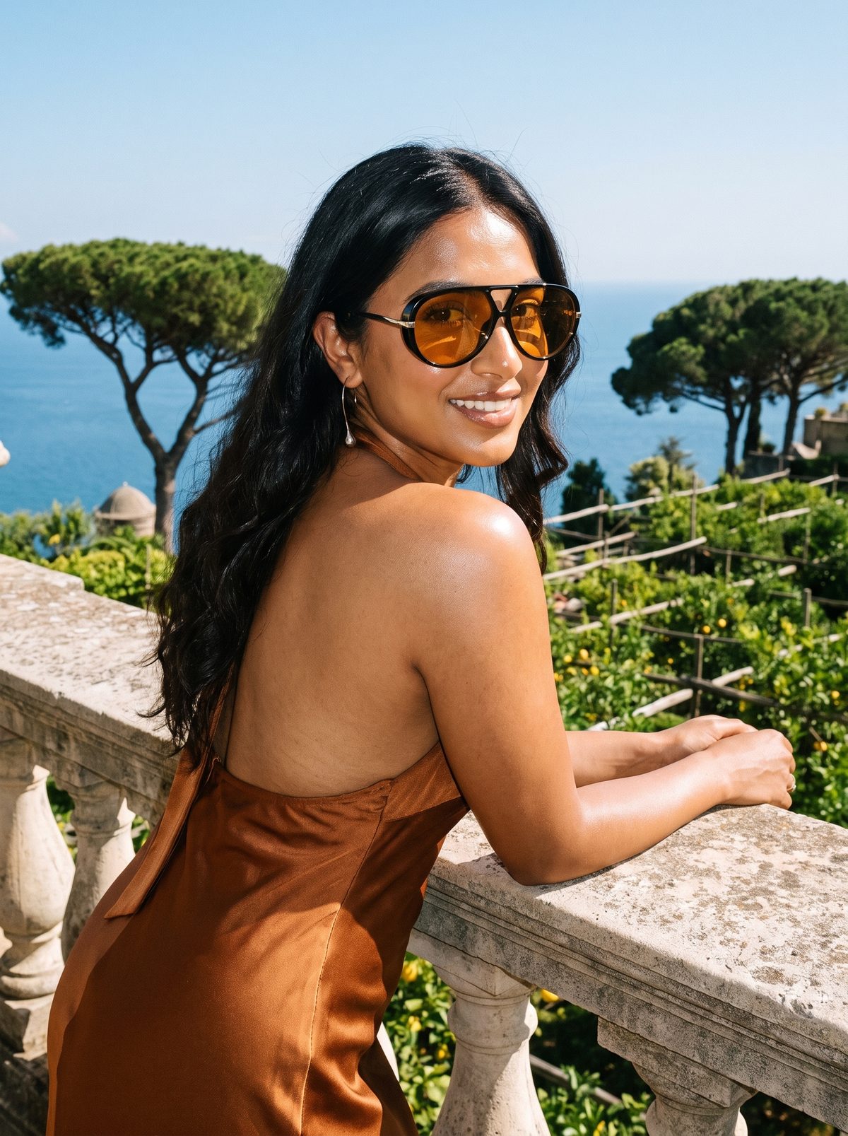 Woman on a Ravello balcony wearing RIVA sunglasses